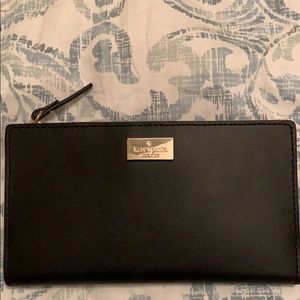 Kate Spade leather trifold wallet.